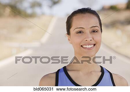 Stock Image - Confident Hispanic woman smiling. Fotosearch