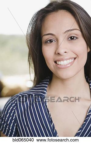 Stock Image - Confident Hispanic woman smiling. Fotosearch
