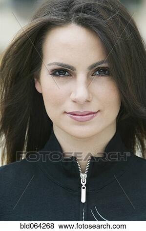 Stock Photo - Confident Hispanic woman smiling. Fotosearch
