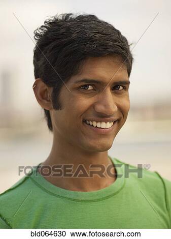 Stock Image - Confident Indian man smiling. Fotosearch