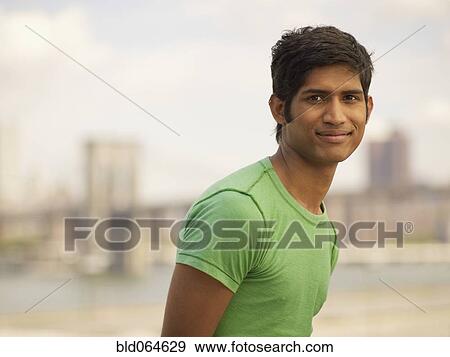 Stock Photo - Confident Indian man smiling. Fotosearch
