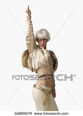 Glamorous Asian woman with arm raised View Large Photo Image Stock Photograph - Glamorous Asian woman with arm raised. Fotosearch