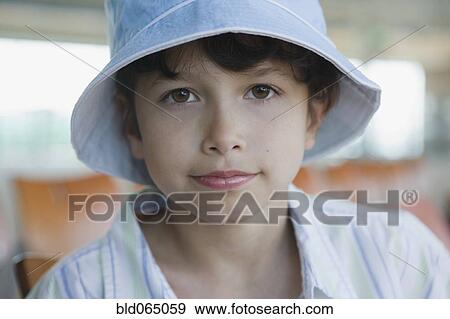 Hispanic boy sitting in airport View Large Photo Image Stock Photo - Hispanic boy sitting in airport. Fotosearch