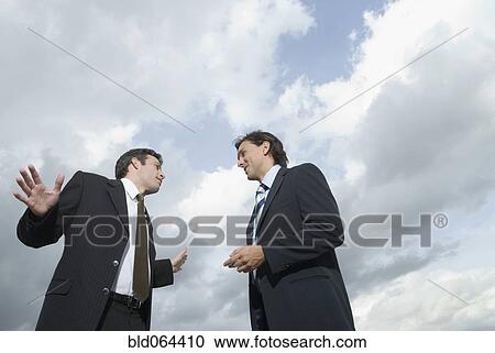 Hispanic businessman talking View Large Photo Image Stock Image - Hispanic businessman talking. Fotosearch