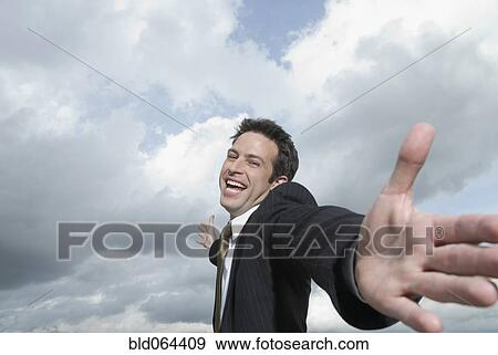 Hispanic businessman with arms outstretched View Large Photo Image Stock Photo - Hispanic businessman with arms outstretched. Fotosearch
