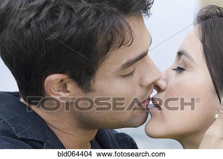 Picture - Hispanic couple about to kiss. Fotosearch