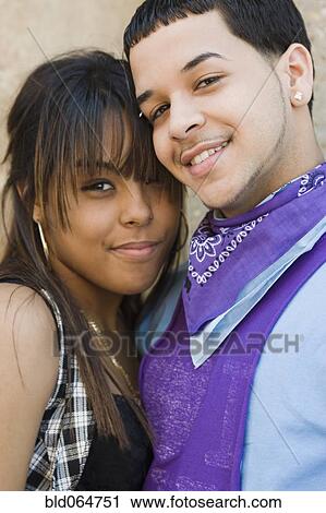 Stock Image - Hispanic couple hugging. Fotosearch