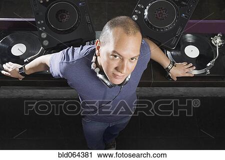 Hispanic DJ performing in nightclub View Large Photo Image Stock Image - Hispanic DJ performing in nightclub. Fotosearch