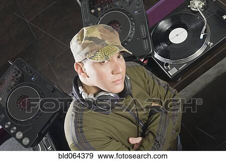 Stock Photo - Hispanic DJ performing in nightclub. Fotosearch