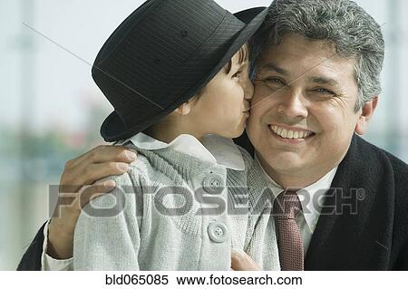 Hispanic girl kissing father’s cheek View Large Photo Image Stock Photography - Hispanic girl kissing father’s cheek. Fotosearch