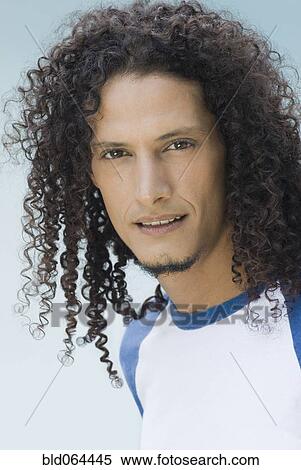 Hispanic Man With Long Curly Hair Stock Photography Bld064445