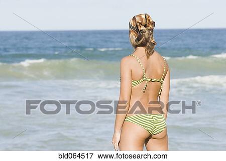 Hispanic woman in bikini at beach View Large Photo Image Stock Photo - Hispanic woman in bikini at beach. Fotosearch