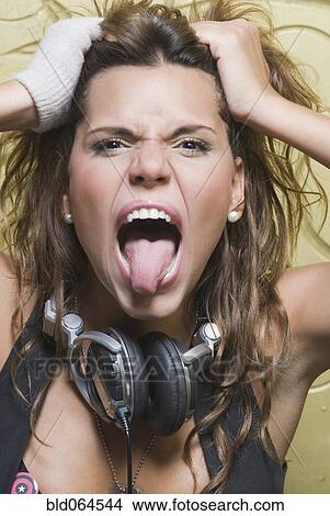Hispanic woman in headphones shouting View Large Photo Image Picture - Hispanic woman in headphones shouting. Fotosearch