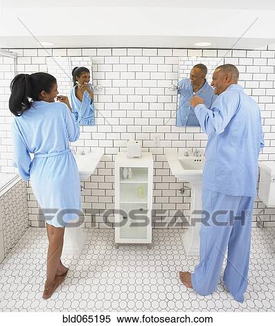 Husband and wife in bathroom together View Large Photo Image Stock Photography - Husband and wife in bathroom together. Fotosearch