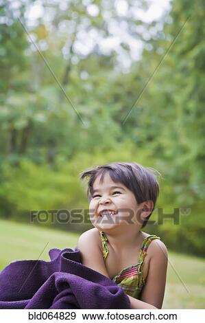 Mixed race girl laughing in park View Large Photo Image Stock Photo - Mixed race girl laughing in park. Fotosearch