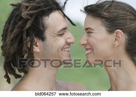 Stock Photo - Multi-ethnic couple smiling. Fotosearch