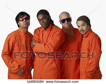 Multi-ethnic criminals in prison uniforms View Large Photo Image Picture - Multi-ethnic criminals in prison uniforms. Fotosearch