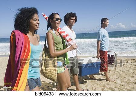 Multi-ethnic friends enjoying the beach View Large Photo Image Stock Image - Multi-ethnic friends enjoying the beach. Fotosearch