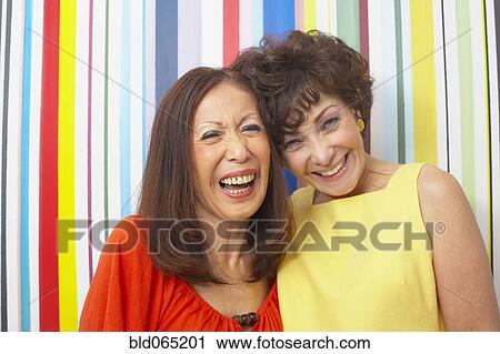 Stock Image - Multi-ethnic friends smiling. Fotosearch