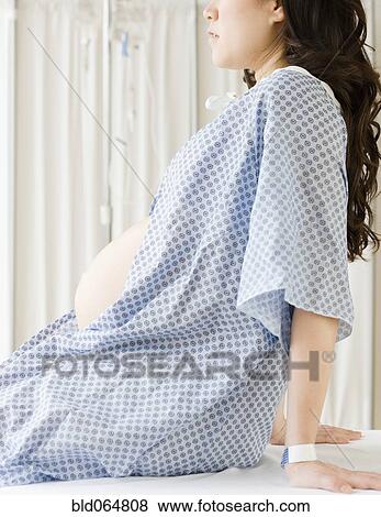 Pregnant Asian woman having checkup in doctor’s office View Large Photo Image Stock Photo - Pregnant Asian woman having checkup in doctor’s office. Fotosearch