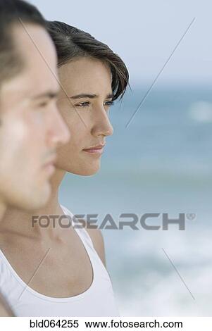 Stock Photography - Serious couple near ocean. Fotosearch
