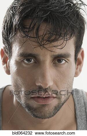 Stock Image - Serious Hispanic man. Fotosearch