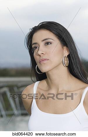 Stock Image - Serious Hispanic woman. Fotosearch
