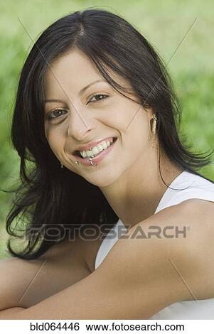 Smiling Hispanic woman with lip ring View Large Photo Image Stock Photograph - Smiling Hispanic woman with lip ring. Fotosearch