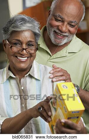 African couple reading food ingredients View Large Photo Image Stock Image - African couple reading food ingredients. Fotosearch