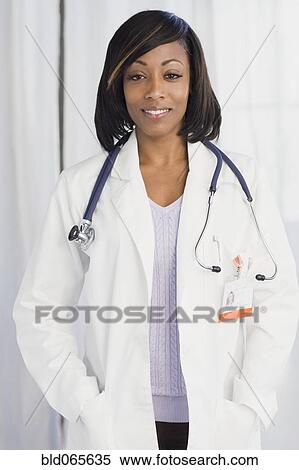 Stock Photography - African doctor in lab coat and stethoscope. Fotosearch