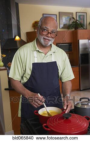 African man cooking dinner View Large Photo Image Stock Image - African man cooking dinner. Fotosearch