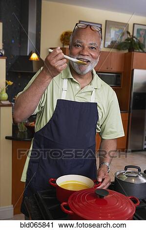 African man cooking dinner View Large Photo Image Stock Image - African man cooking dinner. Fotosearch