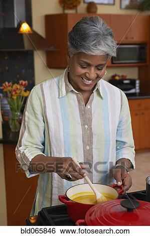 African woman cooking dinner View Large Photo Image Stock Photograph - African woman cooking dinner. Fotosearch