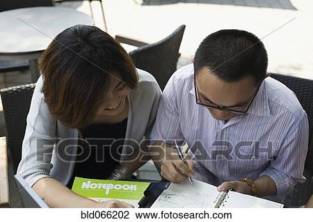 Chinese businesspeople working at cafe View Large Photo Image Stock Image - Chinese businesspeople working at cafe. Fotosearch