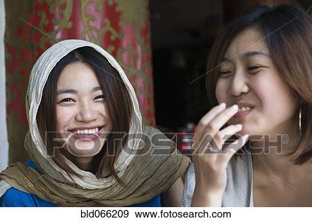 Chinese friends laughing View Large Photo Image Stock Photo - Chinese friends laughing. Fotosearch