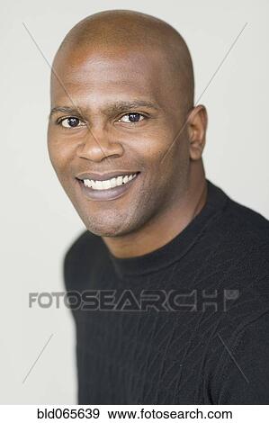 Close up of confident African man View Large Photo Image Stock Photo - Close up of confident African man. Fotosearch