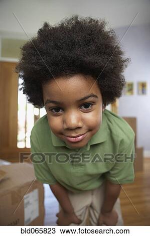 Stock Image - Close up of curious African boy. Fotosearch