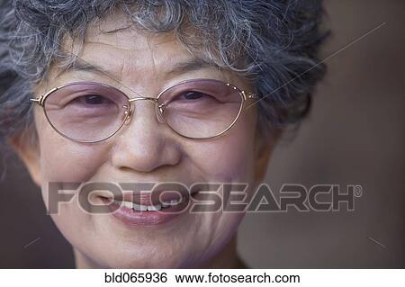 Close up of Japanese woman wearing eyeglasses View Large Photo Image Stock Photograph - Close up of Japanese woman wearing eyeglasses. Fotosearch