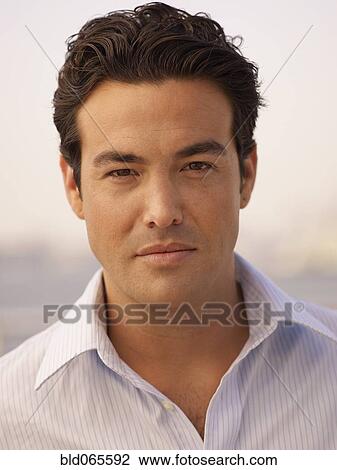 Stock Image - Close up of serious man. Fotosearch