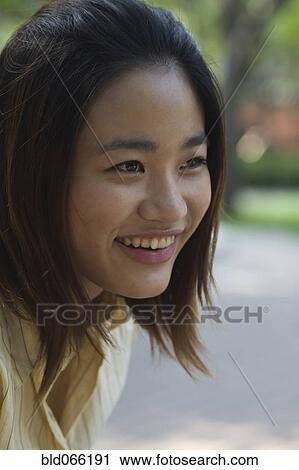 Confident Chinese woman smiling View Large Photo Image Stock Image - Confident Chinese woman smiling. Fotosearch