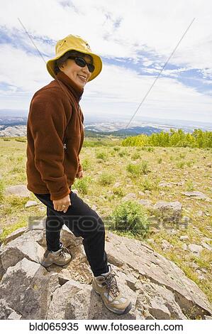 Japanese woman hiking in mountain terrain View Large Photo Image Stock Photography - Japanese woman hiking in mountain terrain . Fotosearch