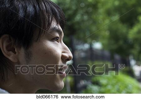 Profile of Japanese man outdoors View Large Photo Image Stock Photograph - Profile of Japanese man outdoors. Fotosearch