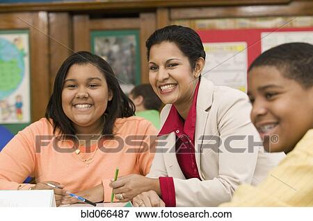 Stock Photo - African teacher and students smiling. Fotosearch