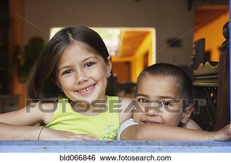 Stock Photograph - Brother and sister smiling. Fotosearch