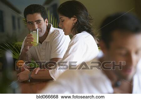 Stock Photo - Couple drinking in bar. Fotosearch