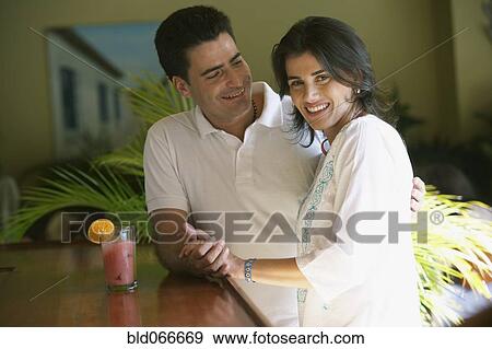 Stock Photo - Couple drinking in bar. Fotosearch
