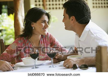 Couple drinking red wine in cafe View Large Photo Image Stock Image - Couple drinking red wine in cafe. Fotosearch