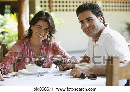 Couple drinking red wine in cafe View Large Photo Image Stock Image - Couple drinking red wine in cafe. Fotosearch