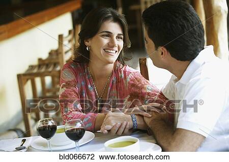 Couple drinking red wine in cafe View Large Photo Image Stock Image - Couple drinking red wine in cafe. Fotosearch