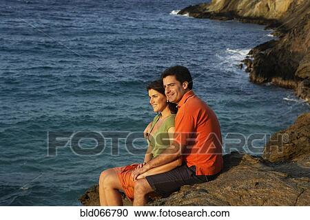 Couple hugging near ocean View Large Photo Image Stock Image - Couple hugging near ocean. Fotosearch